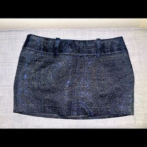 NWOT Bebe mini skirt in Royal blue and black paisley print in size 8.